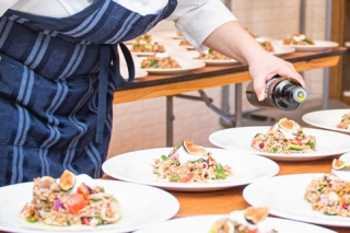 Chef preparing plates of food