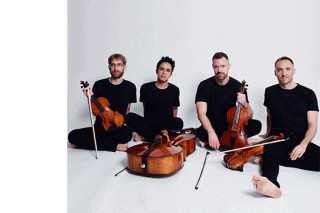 JACK Quartet seated. All wearing black on a white background.