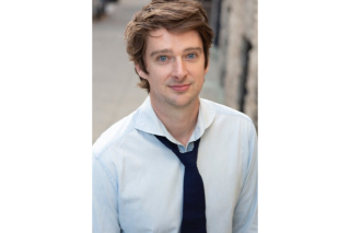 Portrait photography of a man in a white button-down and black tie