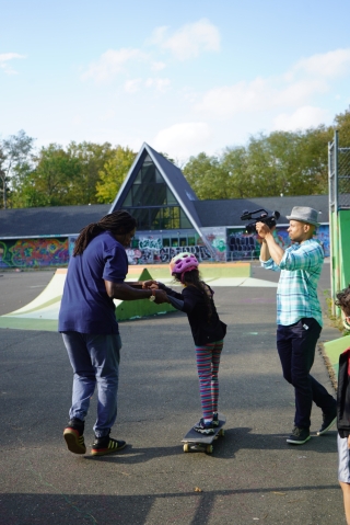 Dr. Neftalie Williams coaches a young skater