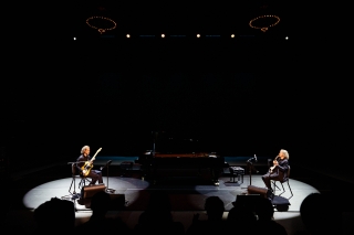 Bryce Dessner and David Chalmin performing guitars on stage